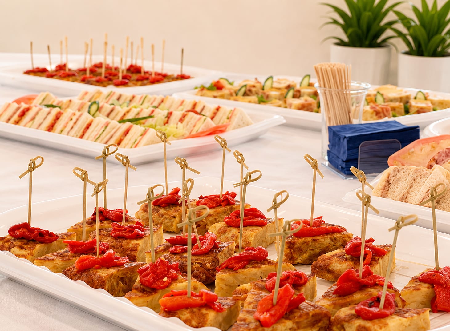 Bite-sized ham and cheese frittata squares from a Freska catering platter